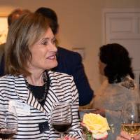 Jim and Donna Brooks talking with two guests.